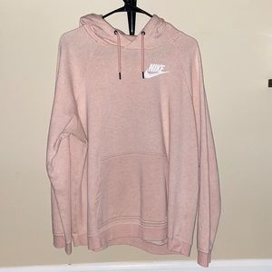 Pastel pink Nike hoodie.